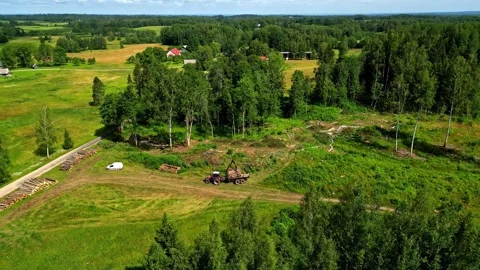 Aerial view of tractor loading logs in rural Latvia. Stock Footage 341945184