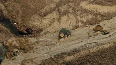 Aerial view of a tractor that performs earthworks at a construction site Stock Footage 227113010