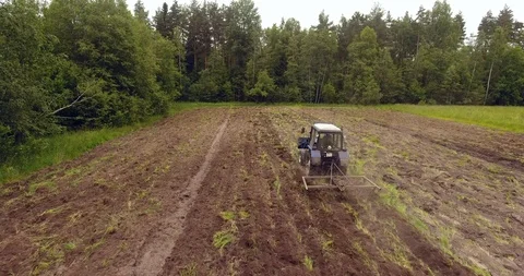 Aerial view of the tractor plowing a field Drone footage Stock Footage 91653645