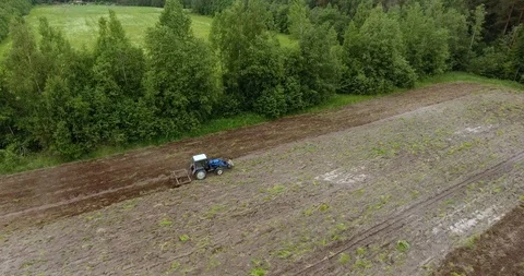 Aerial view of the tractor plowing a field Drone footage Stock Footage 91703712