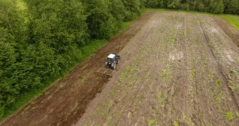 Aerial view of the tractor plowing a field Drone footage Stock Footage 91743822