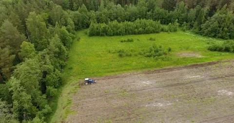 Aerial view of the tractor plowing a field Drone footage Stock Footage 91745387