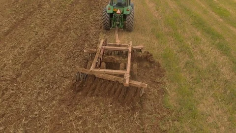 Aerial view of tractor plowing a field Video stock 95336549