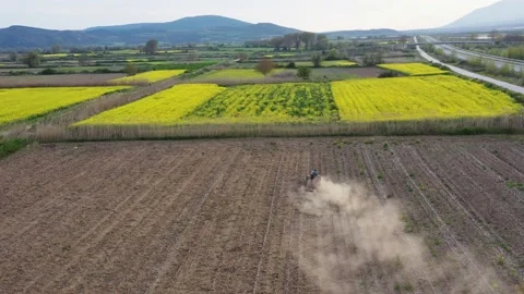 Aerial view of tractor plowing field. Stock Footage 132565510