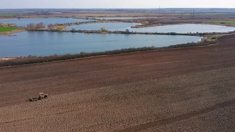 Aerial view of tractor plowing a field2 Stock Footage 105293861