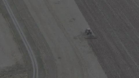 Aerial View of Tractor Plowing Fields in Spring 4K Stock Footage 318679834