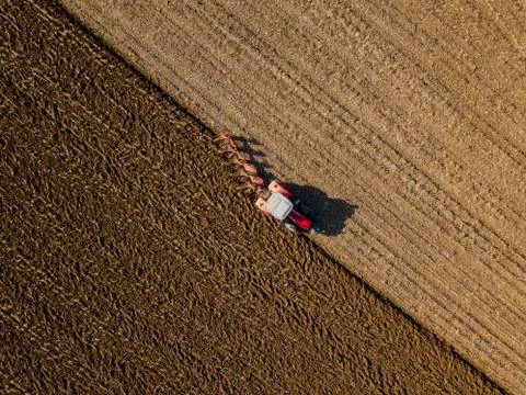 Aerial view, Tractor plowing fields, preparing land for sowing Stock Photos