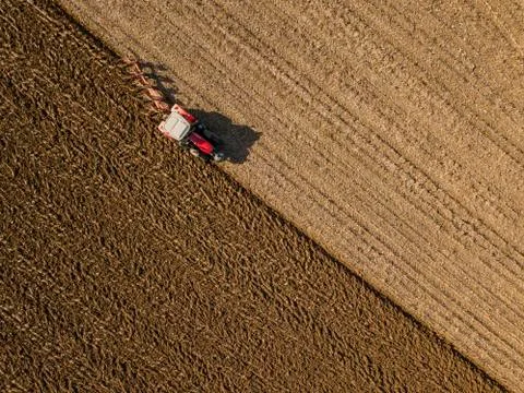 Aerial view, Tractor plowing fields, preparing land for sowing 스톡 사진