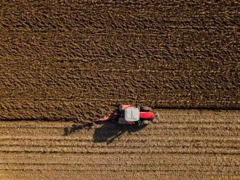 Aerial view, Tractor plowing fields, preparing land for sowing Foto stock