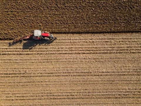 Aerial view, Tractor plowing fields, preparing land for sowing Stock Photos