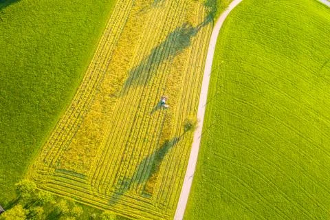 Aerial view of a tractor plowing the fields, aerial view, plowing, sowing, ha Stock Photos