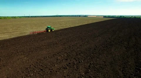 Aerial view of tractor plowing the soil Stock Footage 60698737
