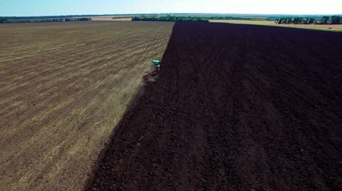 Aerial view of tractor plowing the soil Stock Footage 60698933