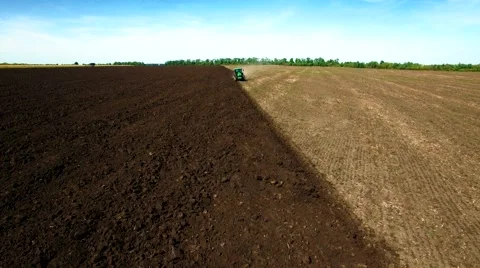 Aerial view of tractor plowing the soil Stock Footage 60699119