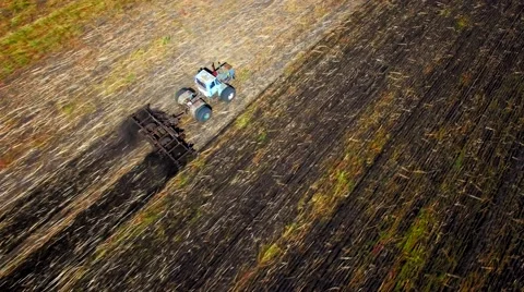 Aerial view of tractor plowing the soil Stock Footage 60702865
