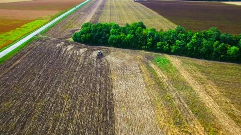 Aerial view of tractor plowing the soil Stock Footage 60703111