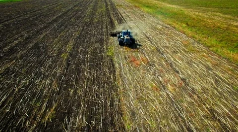 Aerial view of tractor plowing the soil Stock Footage 60703443