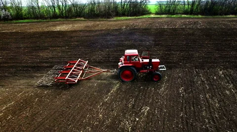 Aerial view of tractor plowing the soil Stock Footage 62397532