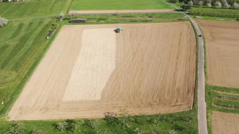 Aerial view. Tractor plows a field near Ortenberg in the Black Forest Video stock 137951493