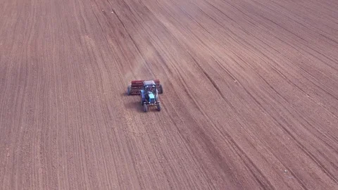 Aerial view of tractor on Prepare a field for planting Stock Footage 76242298
