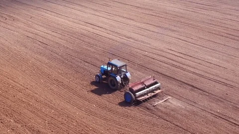 Aerial view of tractor on Prepare a field for planting Stock Footage 76242771