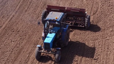 Aerial view of tractor on Prepare a field for planting Stock Footage 76242879