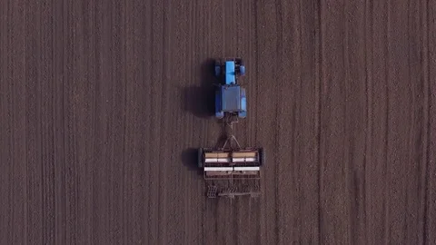 Aerial view of tractor on Prepare a field for planting Stock Footage 76243128