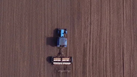 Aerial view of tractor on Prepare a field for planting Stock Footage 76243161