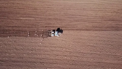 Aerial view of tractor on Prepare a field for planting Stock Footage 76243444