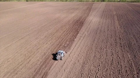 Aerial view of tractor on Prepare a field for planting Stock Footage 76243487