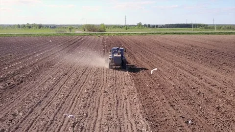 Aerial view of tractor on Prepare a field for planting Stock Footage 76243601