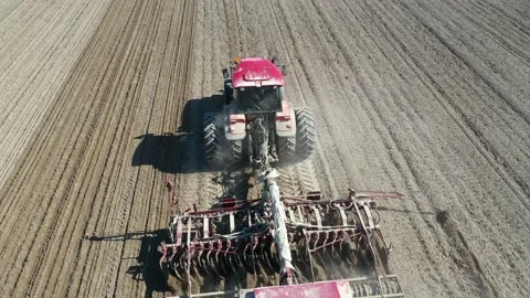 Aerial view Tractor preparing field, Agriculture tractor landscape Video stock 128277079