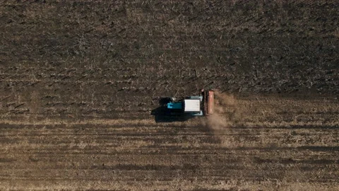 Aerial view of a tractor as pulling machine, arable field Stock Footage 152594418