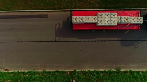 Aerial view of tractor pulling trailer with concrete blocks, Latvia. 库存影片 340594233