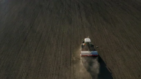 Aerial view of a tractor sowing on a field Stock Footage 134371205