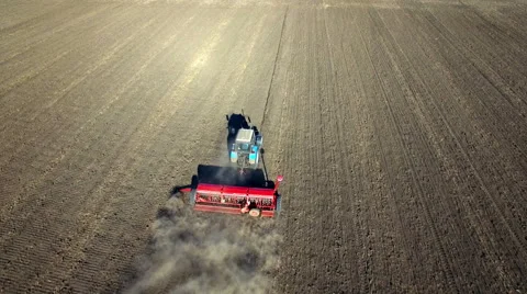 Aerial view of tractor sowing wheat Stock Footage 55777586