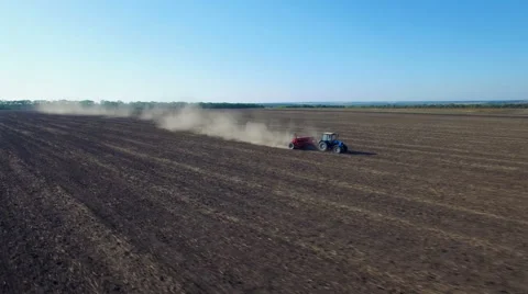 Aerial view of tractor sowing wheat Stock Footage 55778581
