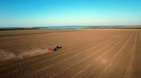 Aerial view of tractor sowing wheat Stock Footage 55783131