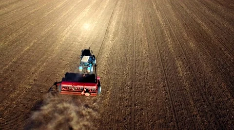 Aerial view of tractor sowing wheat Stock Footage 60699151