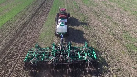 Aerial view of tractor sowing wheat Video stock 78155545
