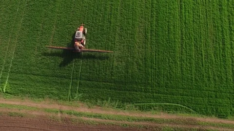 Aerial view of tractor spraying wheat field Stock-Footage 72612659