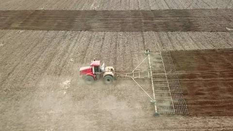 Aerial view of tractor spraying wheat field. Video stock 128599517