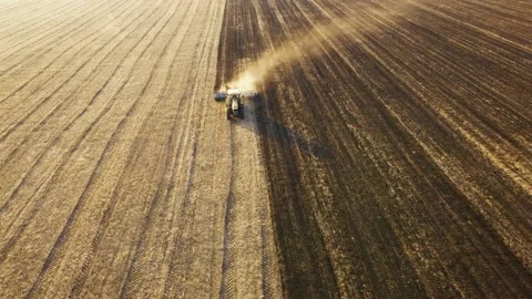 Aerial view of a tractor working in the field. Stockbeeldmateriaal 140900437