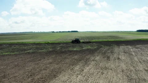 Aerial view of the tractor working in the field Stock Footage 162796590