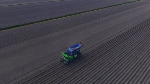 Aerial view of a tractor working in a field in Middenbeemster, Netherlands. Stock Footage 334325016