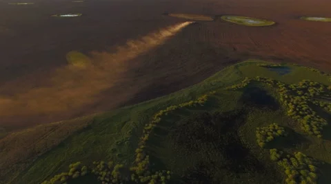 Aerial view tractor working in the vast field Stock Footage 64161074