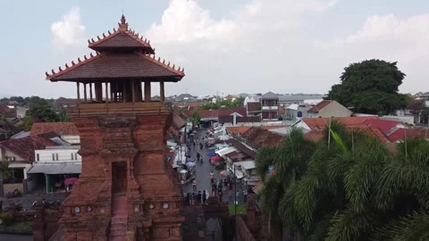 Aerial view of traditional brick tower and urban market Stock-Footage 279523948
