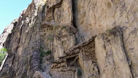 Aerial View of Traditional Stone Structure Built Into Cliff Stock Footage 344120814