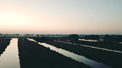 Aerial view of a traditional windmill at sunset in The Netherlands. Stock Footage 183340797