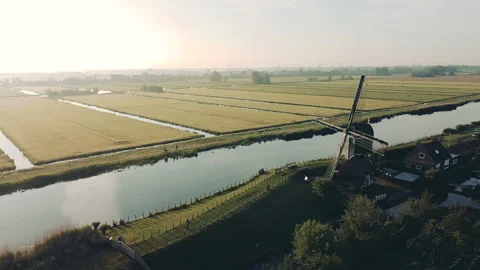 Aerial view of a traditional windmill at sunset in The Netherlands. Stock Footage 183342836